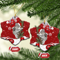 Red ceramic heart-shaped koala Santa ornament hanging on tree with gold loop
