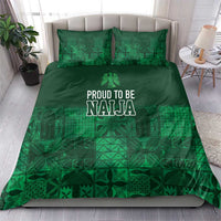 Dark green duvet and matching pillows with adire-inspired geometric pattern and “PROUD TO BE NAJA” print