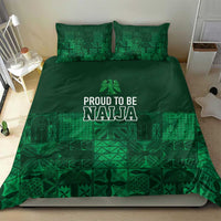Dark green duvet and pillow set with adire geometric patterning and “PROUD TO BE NAJA” lettering