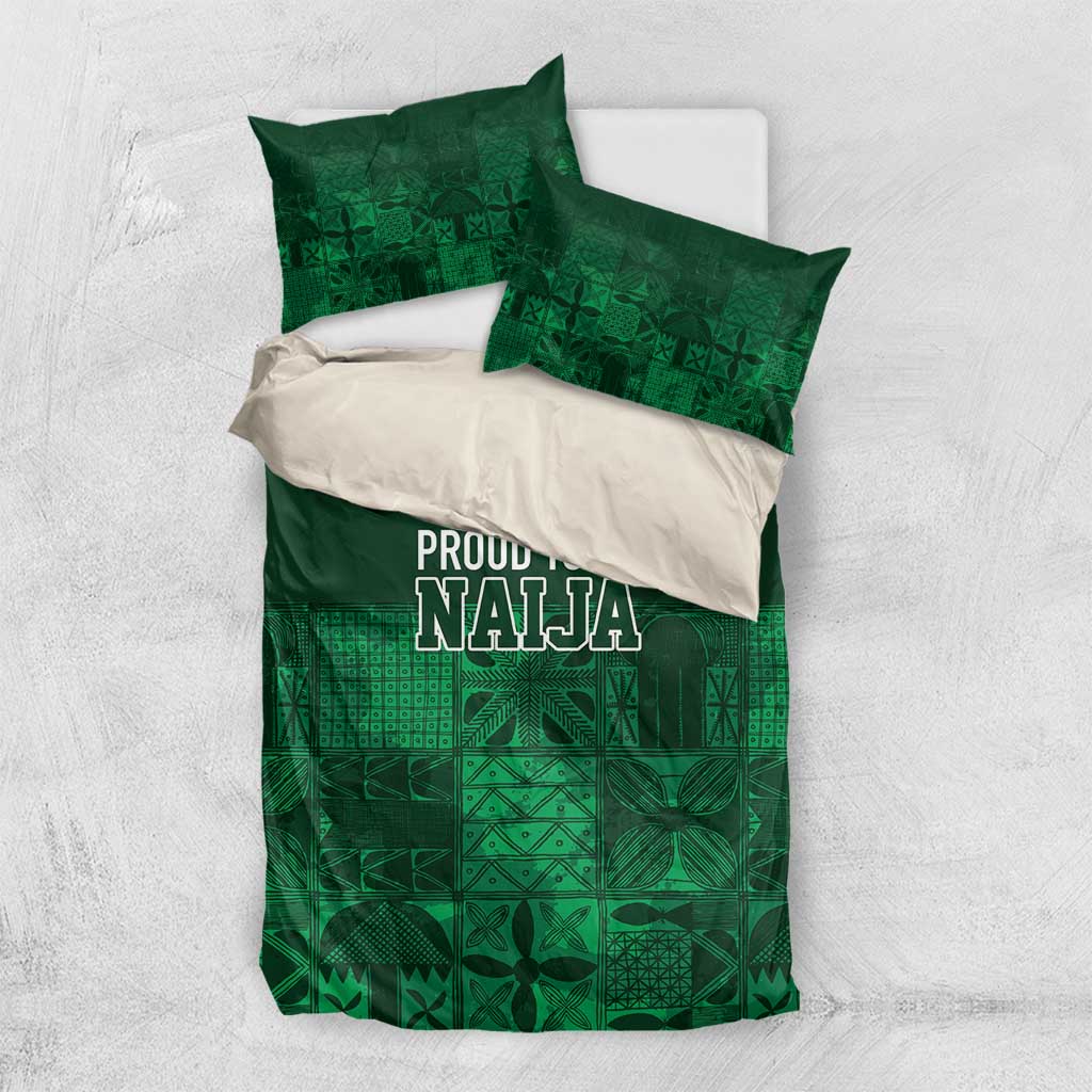 Dark green bedding set with adire-style geometric blocks and “PROUD TO BE NAJA” print, two pillows