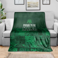 Dark green adire-pattern blanket featuring 'Proud to be Naija' text and patterned panels