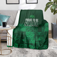 Dark green adire-pattern blanket with 'Proud to be Naija' text and grid-like design