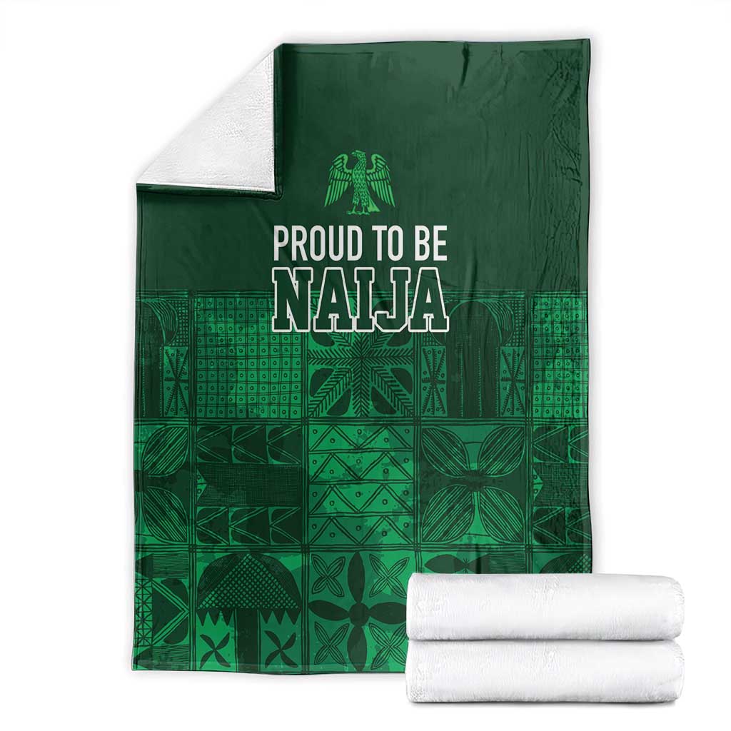 Dark green adire-pattern blanket with 'Proud to be Naija' headline and geometric print