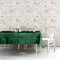 Dark green tablecloth with Yoruba-inspired adire geometric motifs, on dining table