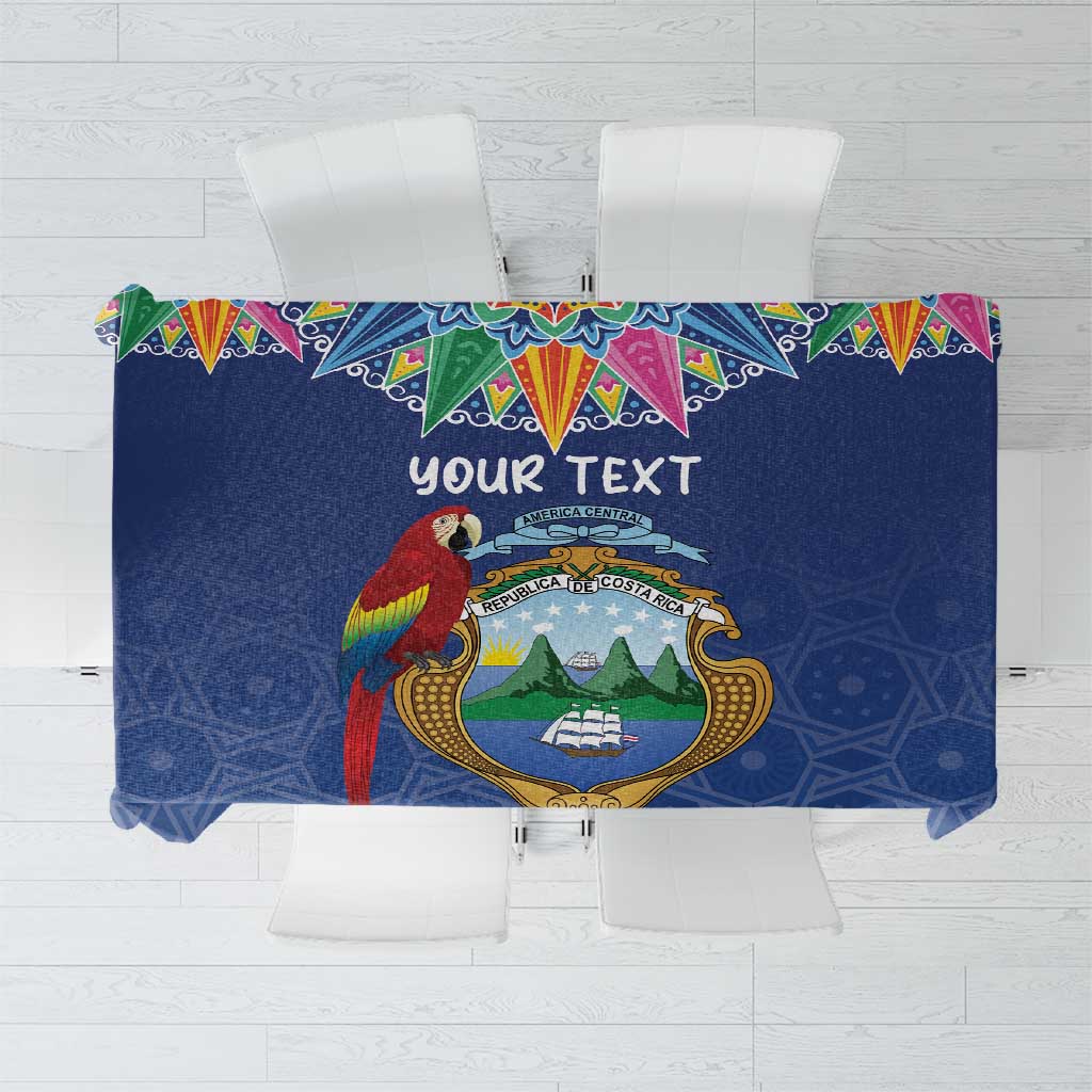 Personalized blue tablecloth with colorful border and crest design