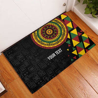 Black rubber doormat with circular medallion, geometric triangles, and YOUR TEXT