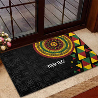 Black rubber doormat with circular medallion, colorful triangle pattern, and YOUR TEXT