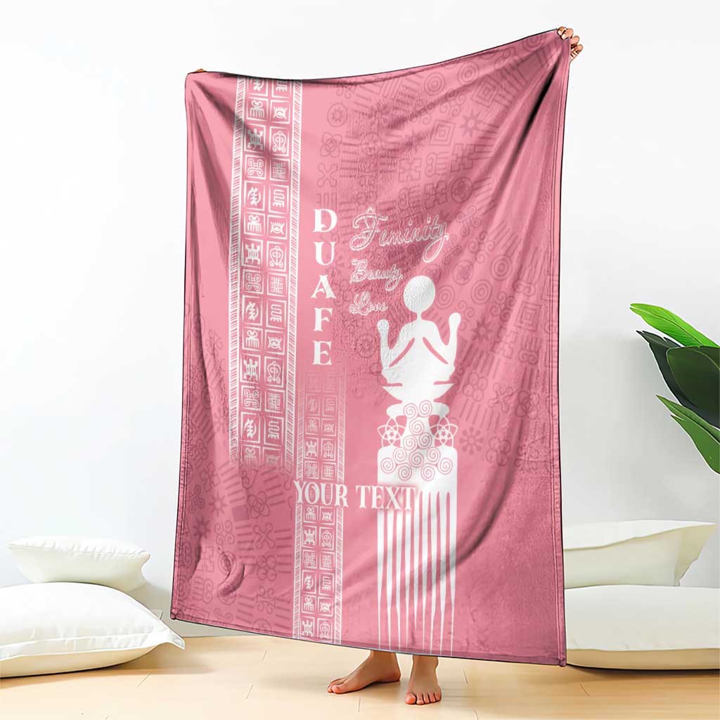 Pink blanket with white “YOUR TEXT” and woman figure with traditional patterned border