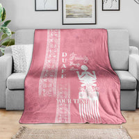 Pink blanket draped on a sofa with white “YOUR TEXT” and woman motif center panel