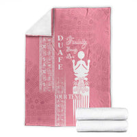 Pink blanket folded with white “YOUR TEXT” and woman motif, plus patterned side stripes