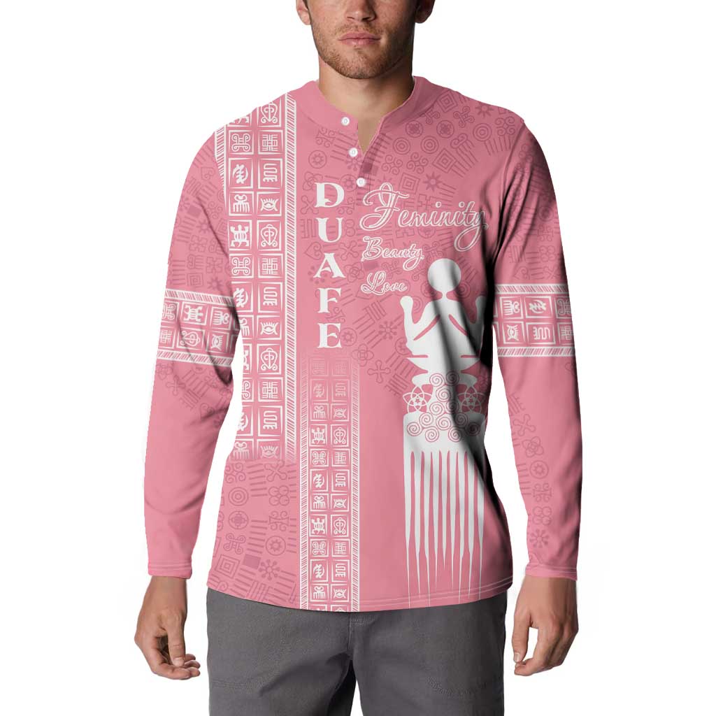 Pink button-up sweatshirt with white figure graphic and long-sleeve patterned side panels
