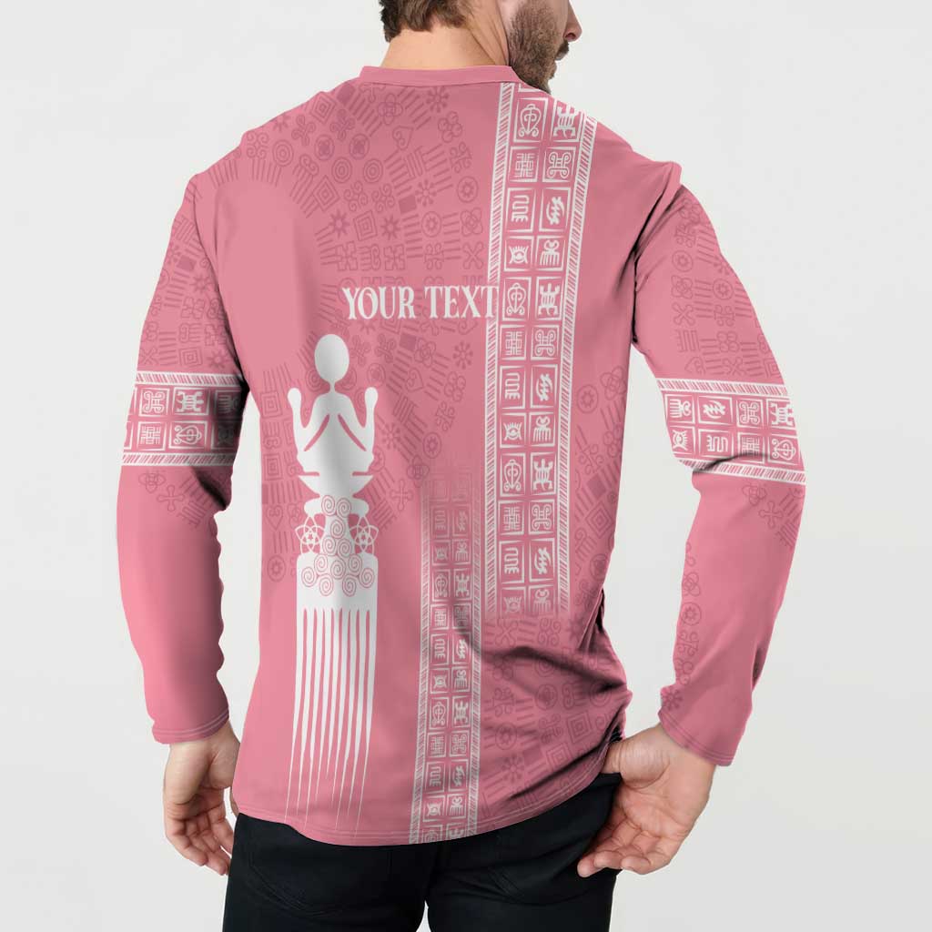 Pink button-up sweatshirt with white back graphic and vertical patterned stripes