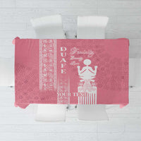 Pink tablecloth flat lay with printed symbols and an editable text area