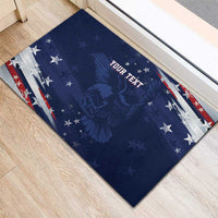 Blue rubber entry doormat with eagle silhouette, stars, and red-white striped edge