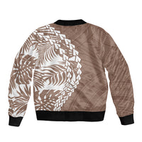 Unisex brown bomber jacket with white tropical tribal back print, black ribbed hem and cuffs