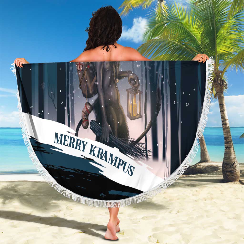 Round dark teal beach blanket with Krampus holding reins and lantern, white fringed border.