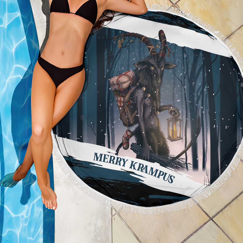 Round dark teal beach blanket with Krampus and lantern graphic, fringed border, close-up.