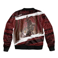 Red bomber jacket with winter forest scene graphic and Merry Krampus text, ribbed hem