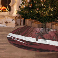 Red tree skirt with woodland Krampus print, circular shape with white trim