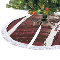 Red Krampus-printed circular tree skirt with white fringe trim, flat view