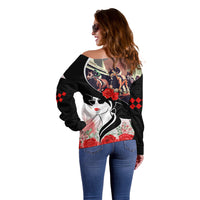 Black off-shoulder sweater side view, derby horses and roses with red argyle details
