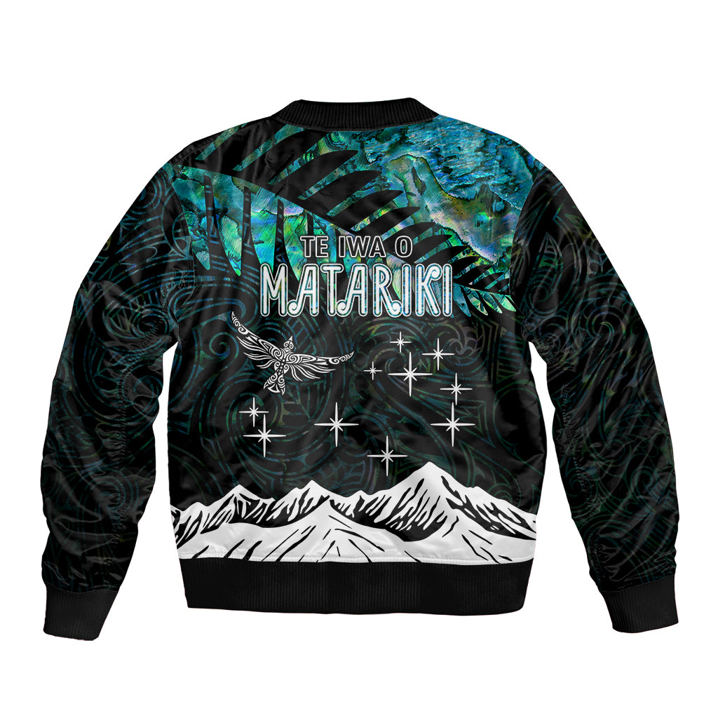 Bomber jacket with teal-black back text 'TE IVA O MATARIKI' and zip front