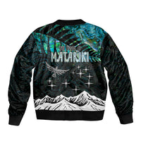 Bomber jacket with teal-black back text 'TE IVA O MATARIKI' and zip front