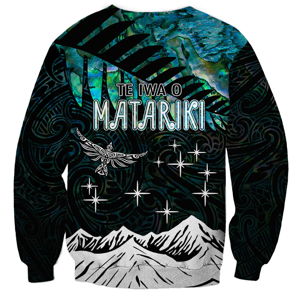 Unisex crewneck sweatshirt, black with blue night graphic, 'TE IWA O MATARIKI' text, stars