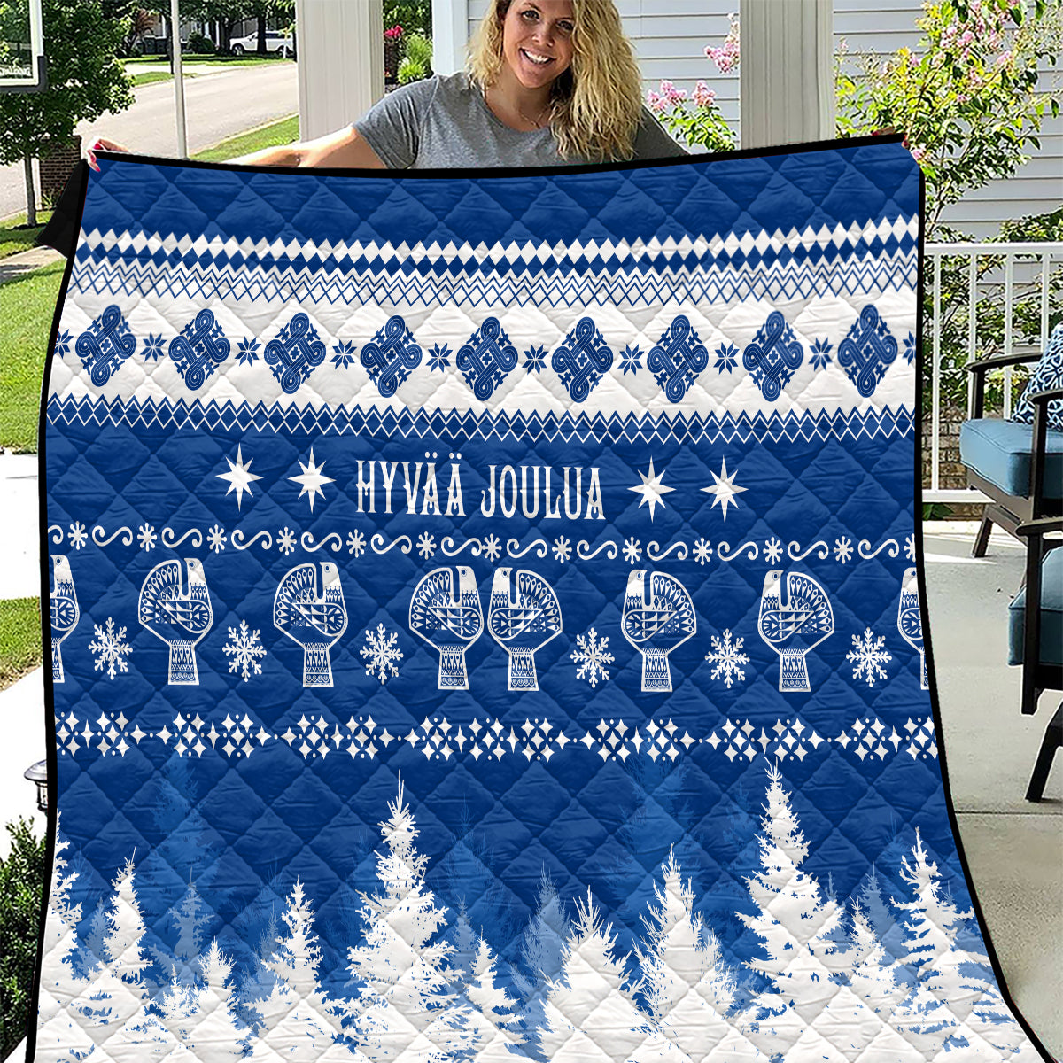 Blue and white Finnish Christmas quilt blanket with “Hyvaa Joulua” and snowflake patterns