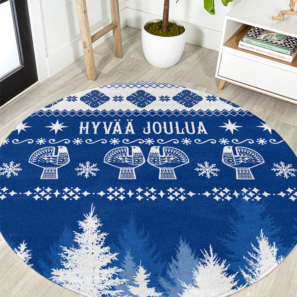 Round blue Christmas rug with white Finnish-style motif and trees