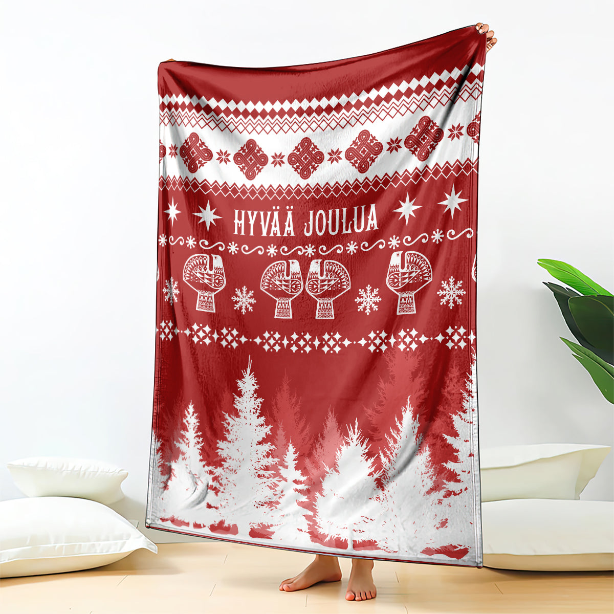 Red Christmas blanket with Finnish pattern and Hyvää Joulua text