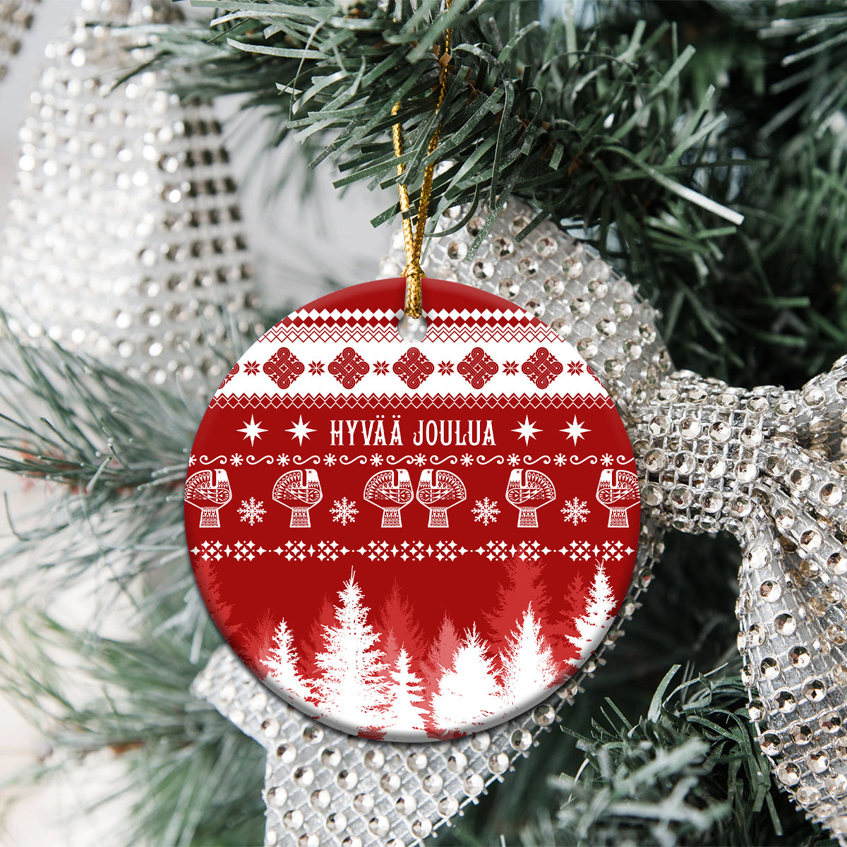 Round red ceramic Christmas ornament with Nordic pattern and hanging cord
