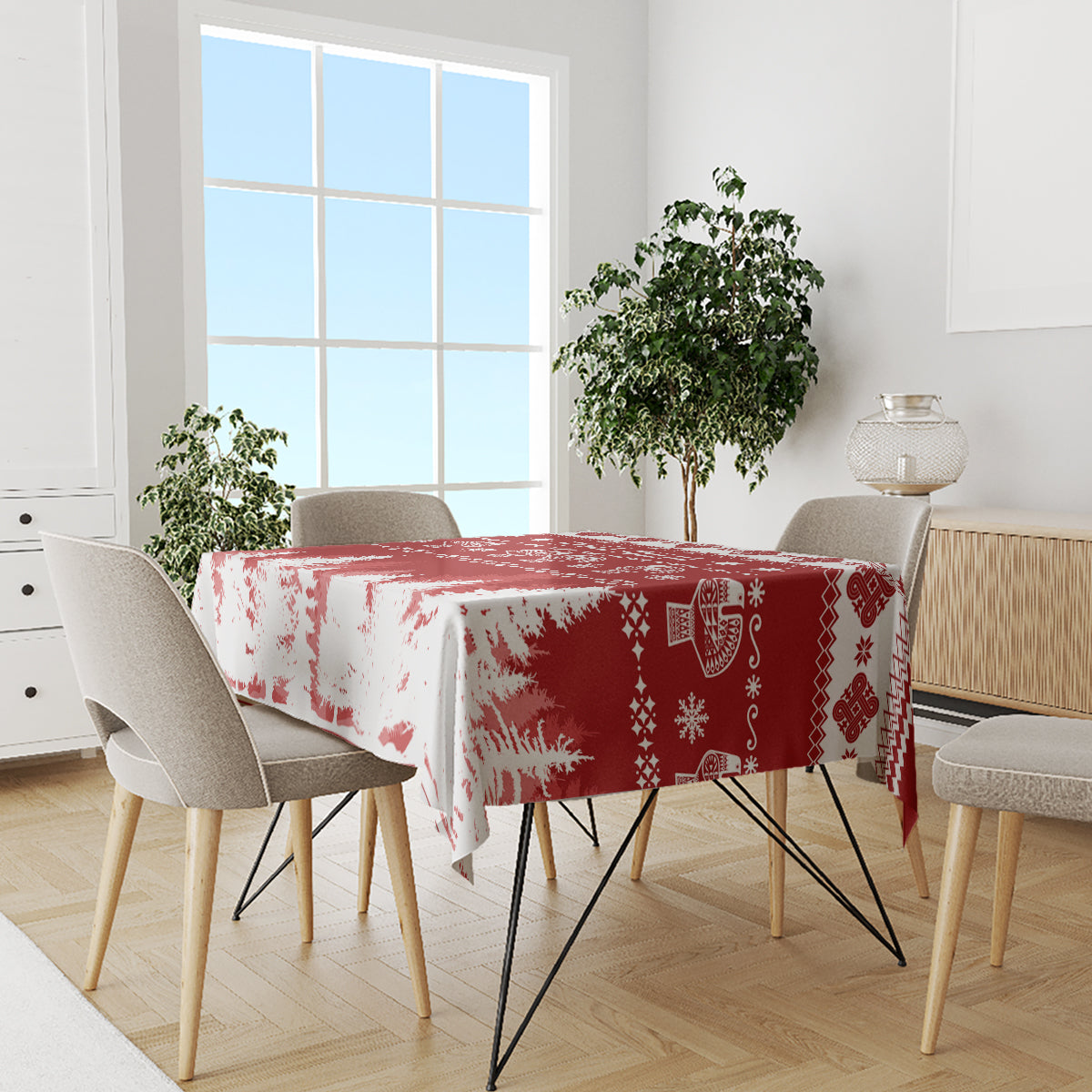 Red and white Christmas tablecloth on dining table with snowflake and icon details