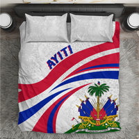 White bedding set with two pillows and Haiti flag graphic, blue red stripes and palm