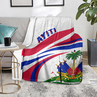 Haiti flag style blanket with diagonal blue and red stripes and green emblem on light gray.