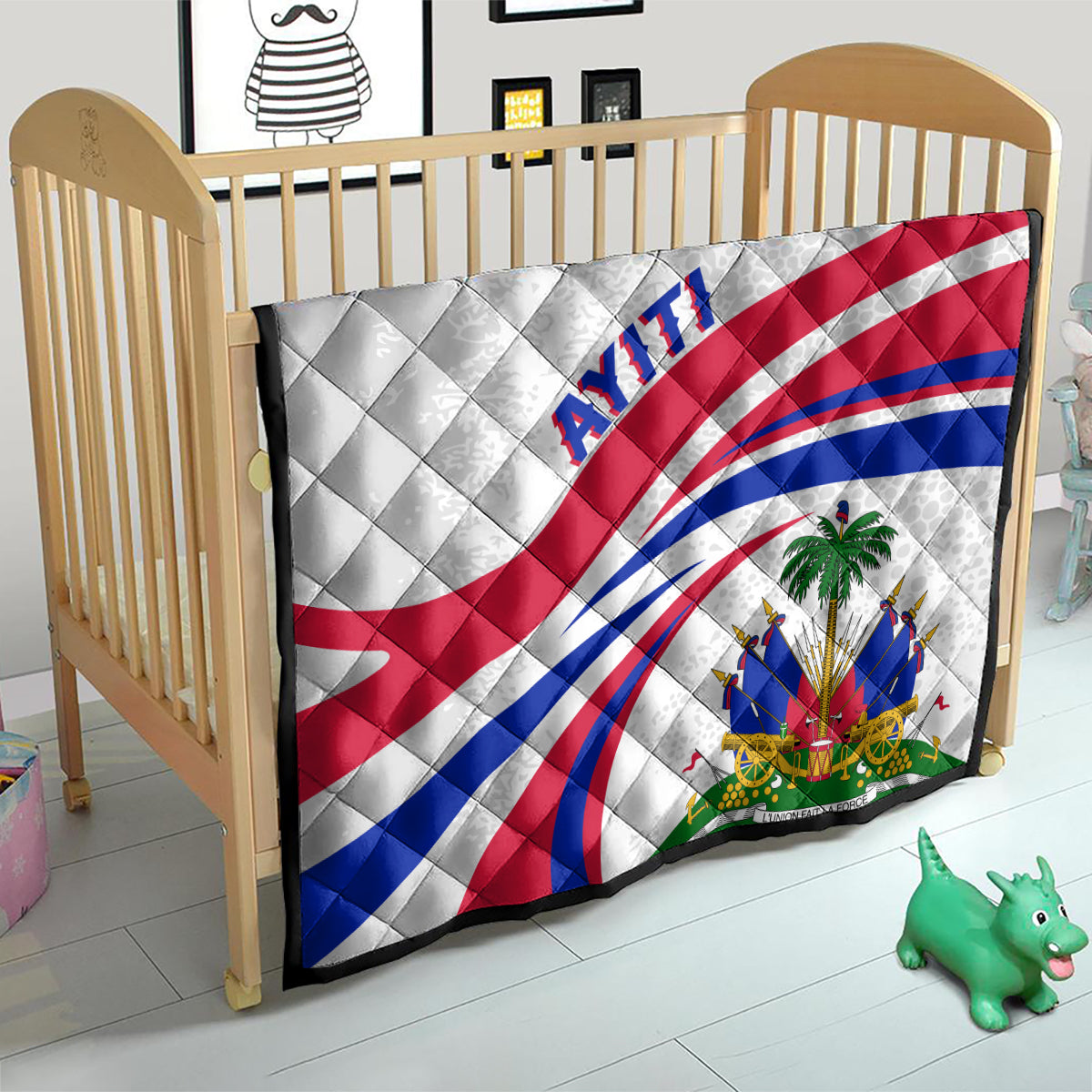 Haiti Independence quilt in a baby bed, white with red/blue flag curves and 'AYITI'.