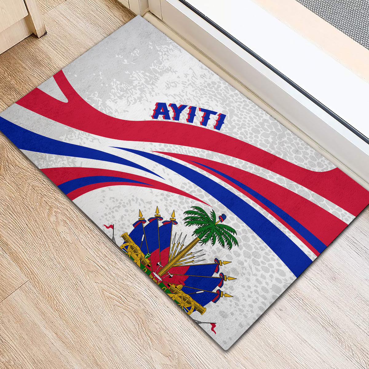 Haiti-themed rubber doormat shown diagonally, gray speckle background, AYITI and flag rays