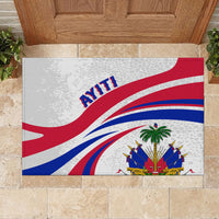 Haiti-themed rubber doormat laid on stone tiles, flag rays, AYITI text, crest