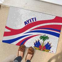 Haiti-themed rubber doormat with flag rays and AYITI text, featuring illustrated crest at bottom