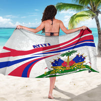 White sarong with red and blue diagonal flag stripes and crest with palm trees