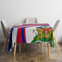 Haiti independence anniversary tablecloth on dining table, bold red and blue striped border