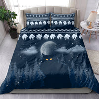 Blue Christmas bedding set on bed with cat border, stars, moon, and pine trees