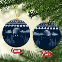 Blue ceramic Christmas ornament, round disc with snowy night forest and cat faces, gold hanger
