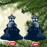 Blue ceramic Christmas tree-shaped ornament with snowy night forest, cat faces, and gold hanger