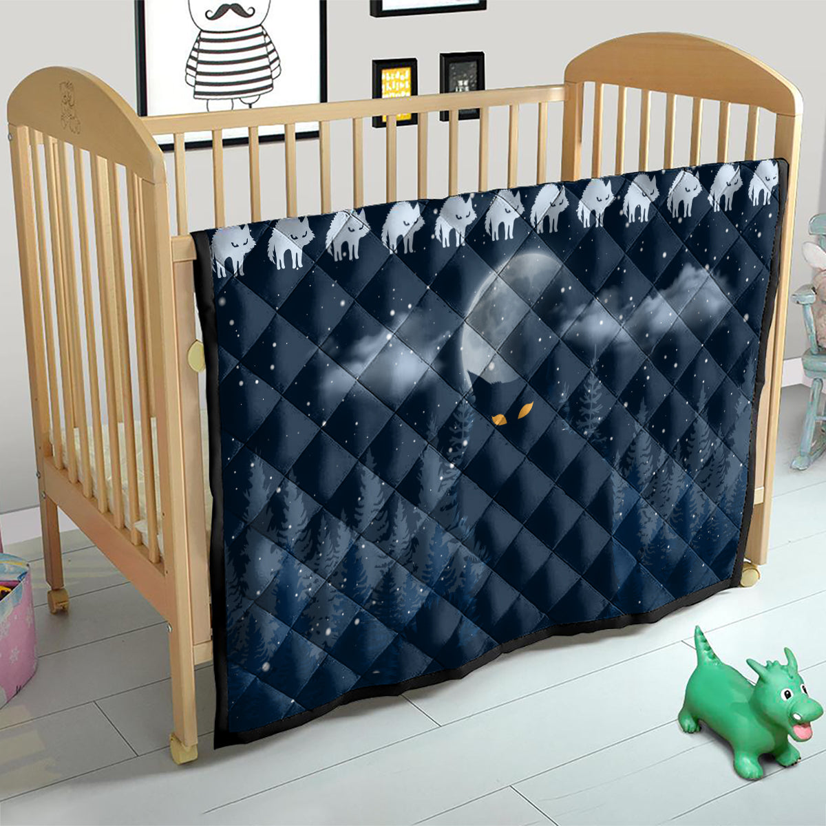Blue cat Christmas quilt in a crib, white cat silhouettes and diamond quilting center