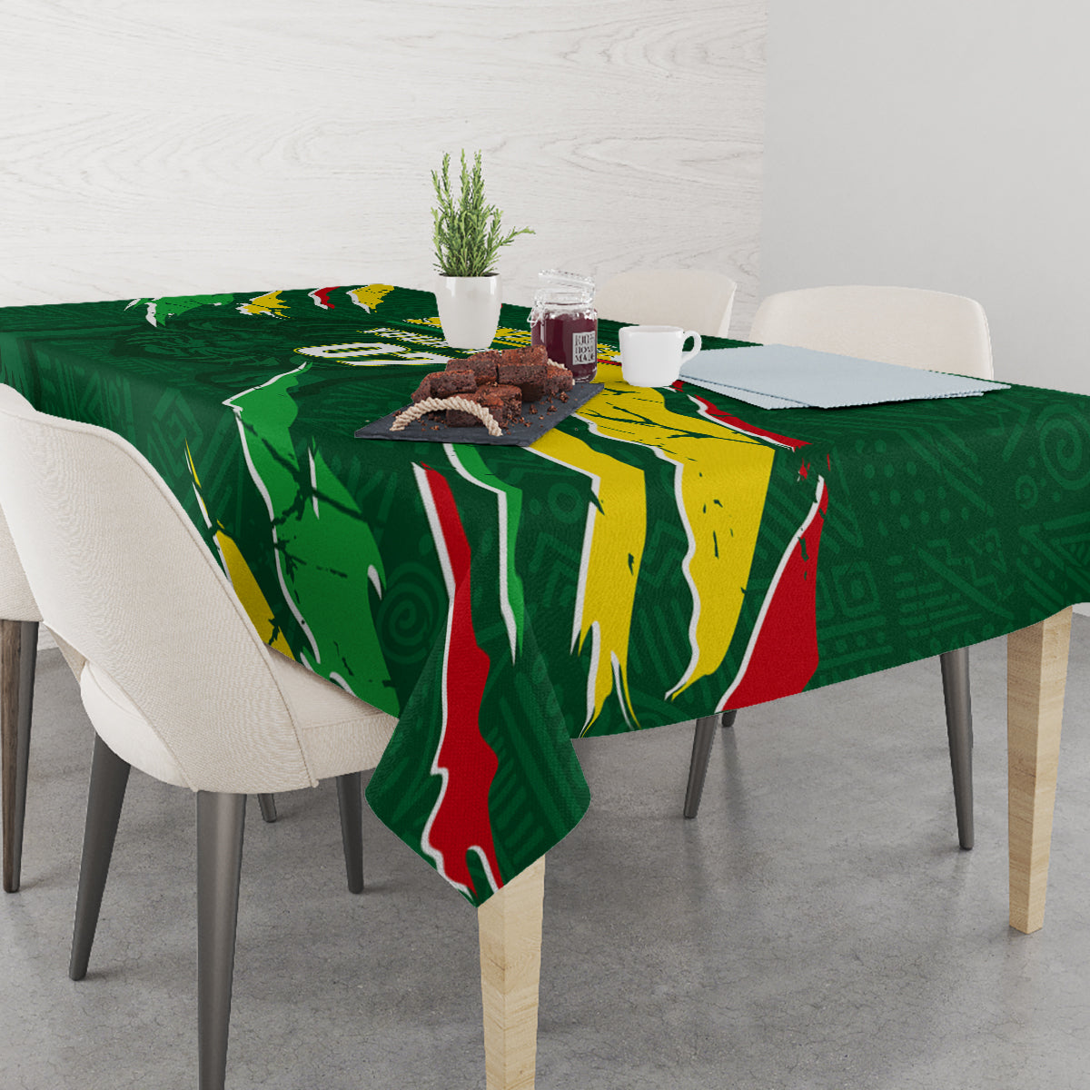Green football tablecloth with Senegal flag print, draped over dining table