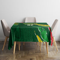 Green football tablecloth on dining table, Senegal flag and team graphic center