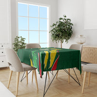 Green football tablecloth on dining table, Senegal flag artwork with red stripe