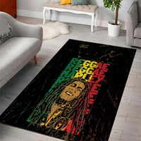 Black rectangular area rug with stacked reggae text in green, red, and yellow.