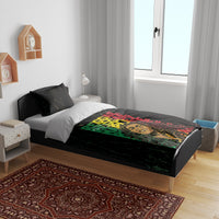 Black bedding set with grunge 'REGGAE' typography in a multicolor green/red/yellow design